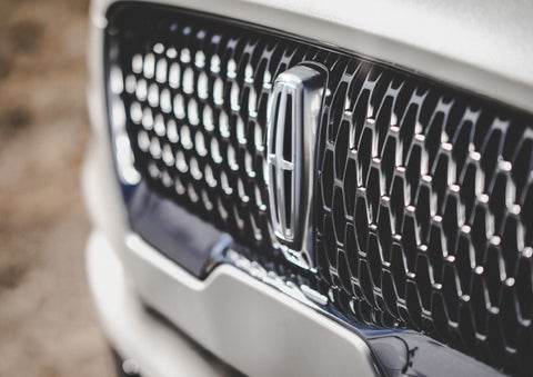 The grille of the 2024 Lincoln Aviator® Reserve model with an eye-catching repeated field of Lincoln Star logo shapes | Doggett Lincoln of Beaumont in Beaumont TX