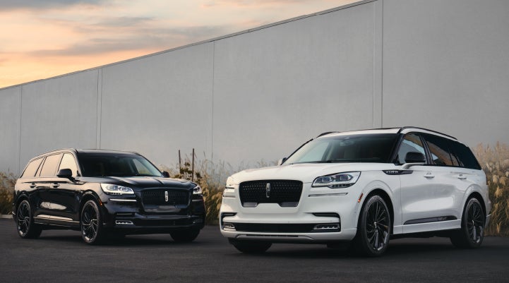 Two Lincoln Aviator® SUVs are shown with the available Jet Appearance Package | Doggett Lincoln of Beaumont in Beaumont TX