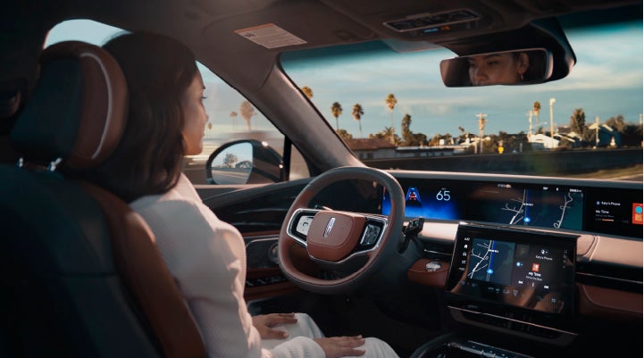 A person is shown driving hands-free on the highway with available Lincoln BlueCruise technology. | Doggett Lincoln of Beaumont in Beaumont TX