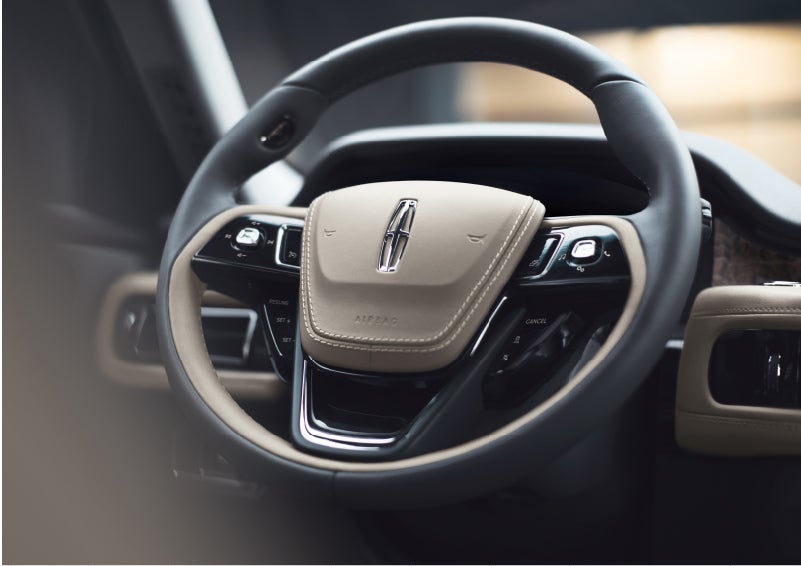 The intuitively placed controls of the steering wheel on a 2023 Lincoln Aviator® SUV | Doggett Lincoln of Beaumont in Beaumont TX