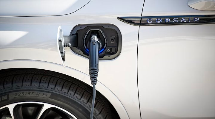 An electric charger is shown plugged into the charging port of a Lincoln Corsair® Grand Touring
model. | Doggett Lincoln of Beaumont in Beaumont TX